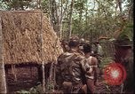 Image of thatched roof hut Pleiku South Vietnam, 1966, second 8 stock footage video 65675058783