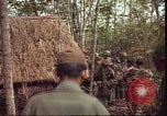 Image of thatched roof hut Pleiku South Vietnam, 1966, second 11 stock footage video 65675058783