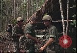 Image of thatched roof hut Pleiku South Vietnam, 1966, second 12 stock footage video 65675058783