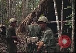 Image of thatched roof hut Pleiku South Vietnam, 1966, second 14 stock footage video 65675058783