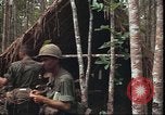 Image of thatched roof hut Pleiku South Vietnam, 1966, second 18 stock footage video 65675058783