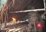 Image of thatched roof hut Pleiku South Vietnam, 1966, second 19 stock footage video 65675058783