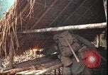 Image of thatched roof hut Pleiku South Vietnam, 1966, second 23 stock footage video 65675058783