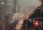Image of thatched roof hut Pleiku South Vietnam, 1966, second 24 stock footage video 65675058783