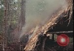 Image of thatched roof hut Pleiku South Vietnam, 1966, second 25 stock footage video 65675058783