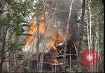 Image of thatched roof hut Pleiku South Vietnam, 1966, second 33 stock footage video 65675058783