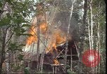 Image of thatched roof hut Pleiku South Vietnam, 1966, second 34 stock footage video 65675058783