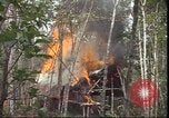 Image of thatched roof hut Pleiku South Vietnam, 1966, second 35 stock footage video 65675058783