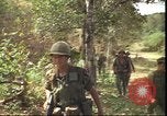 Image of thatched roof hut Pleiku South Vietnam, 1966, second 36 stock footage video 65675058783