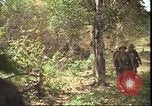 Image of thatched roof hut Pleiku South Vietnam, 1966, second 37 stock footage video 65675058783