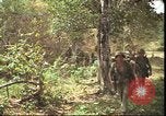 Image of thatched roof hut Pleiku South Vietnam, 1966, second 38 stock footage video 65675058783