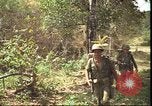 Image of thatched roof hut Pleiku South Vietnam, 1966, second 39 stock footage video 65675058783