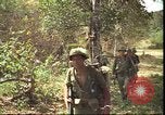 Image of thatched roof hut Pleiku South Vietnam, 1966, second 40 stock footage video 65675058783