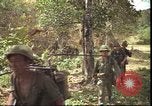 Image of thatched roof hut Pleiku South Vietnam, 1966, second 41 stock footage video 65675058783