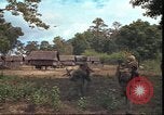 Image of thatched roof hut Pleiku South Vietnam, 1966, second 42 stock footage video 65675058783