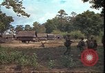 Image of thatched roof hut Pleiku South Vietnam, 1966, second 44 stock footage video 65675058783