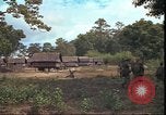 Image of thatched roof hut Pleiku South Vietnam, 1966, second 46 stock footage video 65675058783
