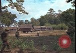 Image of thatched roof hut Pleiku South Vietnam, 1966, second 48 stock footage video 65675058783