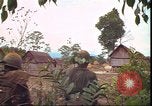 Image of thatched roof hut Pleiku South Vietnam, 1966, second 53 stock footage video 65675058783