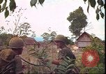 Image of thatched roof hut Pleiku South Vietnam, 1966, second 55 stock footage video 65675058783