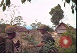 Image of thatched roof hut Pleiku South Vietnam, 1966, second 56 stock footage video 65675058783