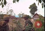 Image of thatched roof hut Pleiku South Vietnam, 1966, second 57 stock footage video 65675058783