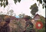 Image of thatched roof hut Pleiku South Vietnam, 1966, second 58 stock footage video 65675058783
