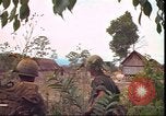 Image of thatched roof hut Pleiku South Vietnam, 1966, second 59 stock footage video 65675058783