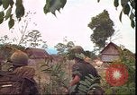 Image of thatched roof hut Pleiku South Vietnam, 1966, second 60 stock footage video 65675058783