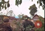 Image of thatched roof hut Pleiku South Vietnam, 1966, second 61 stock footage video 65675058783