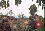 Image of thatched roof hut Pleiku South Vietnam, 1966, second 62 stock footage video 65675058783