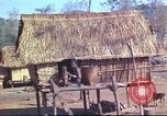 Image of Vietnamese huts Vietnam, 1966, second 24 stock footage video 65675058797
