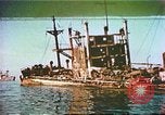 Image of damaged ship Manila Philippines, 1945, second 1 stock footage video 65675058923