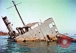 Image of damaged ship Manila Philippines, 1945, second 52 stock footage video 65675058923