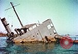Image of damaged ship Manila Philippines, 1945, second 53 stock footage video 65675058923