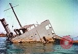 Image of damaged ship Manila Philippines, 1945, second 54 stock footage video 65675058923