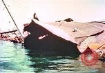 Image of damaged ship Manila Philippines, 1945, second 55 stock footage video 65675058923