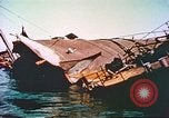 Image of damaged ship Manila Philippines, 1945, second 58 stock footage video 65675058923