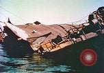 Image of damaged ship Manila Philippines, 1945, second 59 stock footage video 65675058923