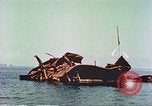 Image of damaged ship Manila Philippines, 1945, second 52 stock footage video 65675058924