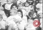Image of chiropractors examining babies Los Angeles California USA, 1931, second 10 stock footage video 65675058948