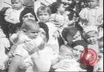 Image of chiropractors examining babies Los Angeles California USA, 1931, second 11 stock footage video 65675058948