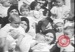 Image of chiropractors examining babies Los Angeles California USA, 1931, second 12 stock footage video 65675058948