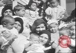Image of chiropractors examining babies Los Angeles California USA, 1931, second 13 stock footage video 65675058948