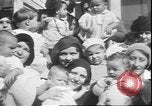 Image of chiropractors examining babies Los Angeles California USA, 1931, second 14 stock footage video 65675058948
