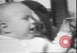Image of chiropractors examining babies Los Angeles California USA, 1931, second 15 stock footage video 65675058948