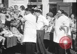 Image of chiropractors examining babies Los Angeles California USA, 1931, second 19 stock footage video 65675058948