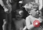 Image of chiropractors examining babies Los Angeles California USA, 1931, second 24 stock footage video 65675058948