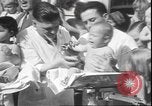 Image of chiropractors examining babies Los Angeles California USA, 1931, second 32 stock footage video 65675058948