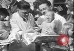 Image of chiropractors examining babies Los Angeles California USA, 1931, second 33 stock footage video 65675058948
